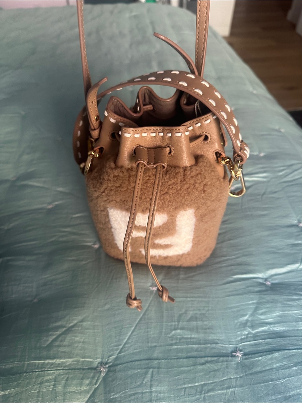 Tan Bucket Crossbody Bag with Decorative Strap
